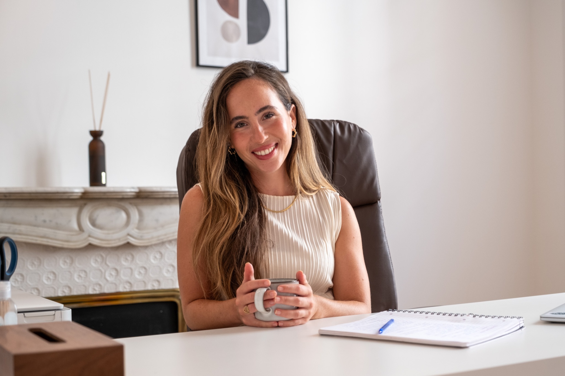 Mora Neustadt, clinical psychologist, seated in her Nice practice